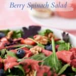 close up of salad in a bowl with dressing with caption "gluten free, vegan berry spinach salad" and "bakeinbalance.com"