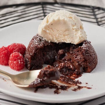 close up of gluten free lava cake with ice cream with bite taken